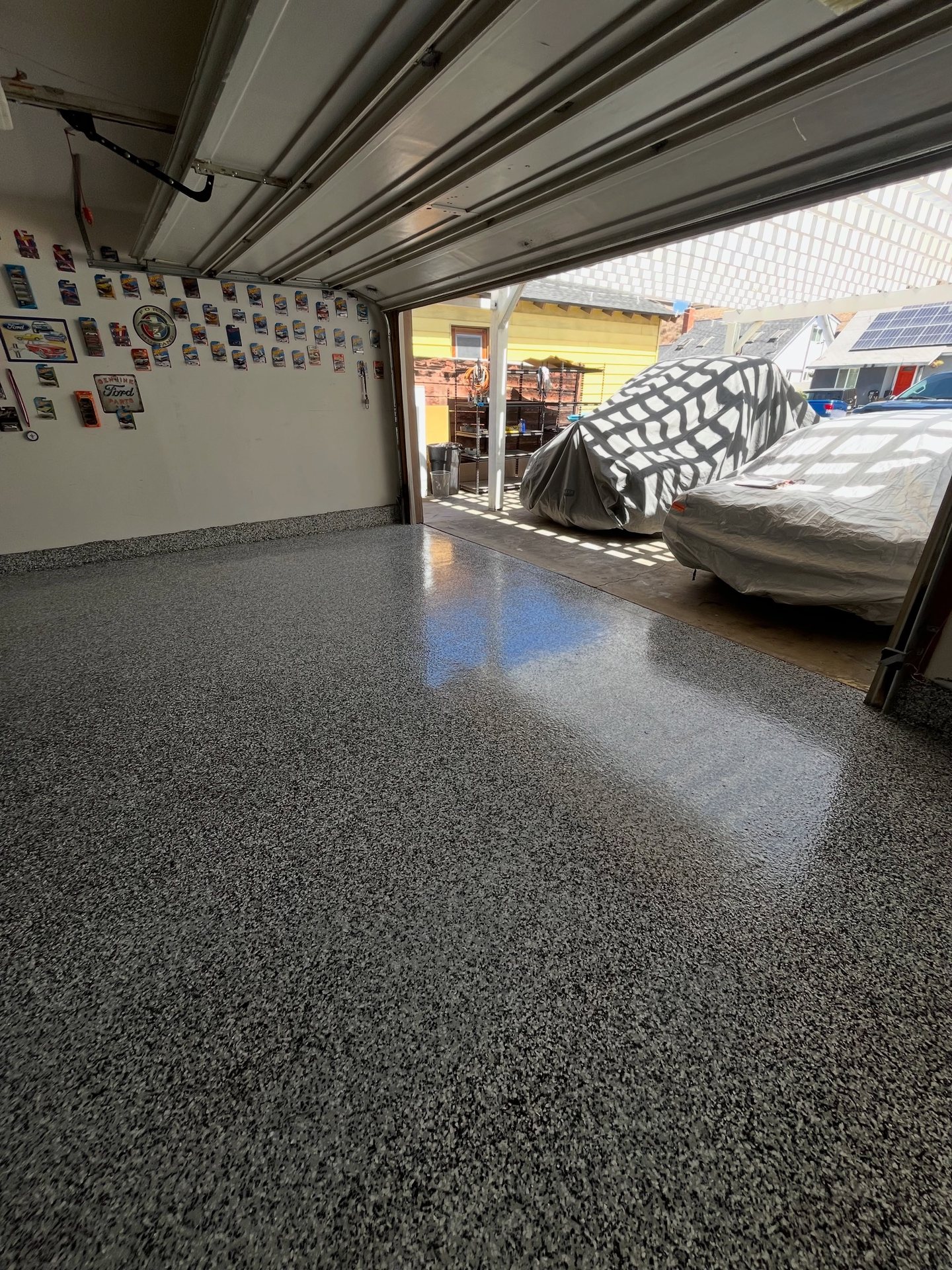 Glossy gray flake garage floor installed by 951Resin Co.
